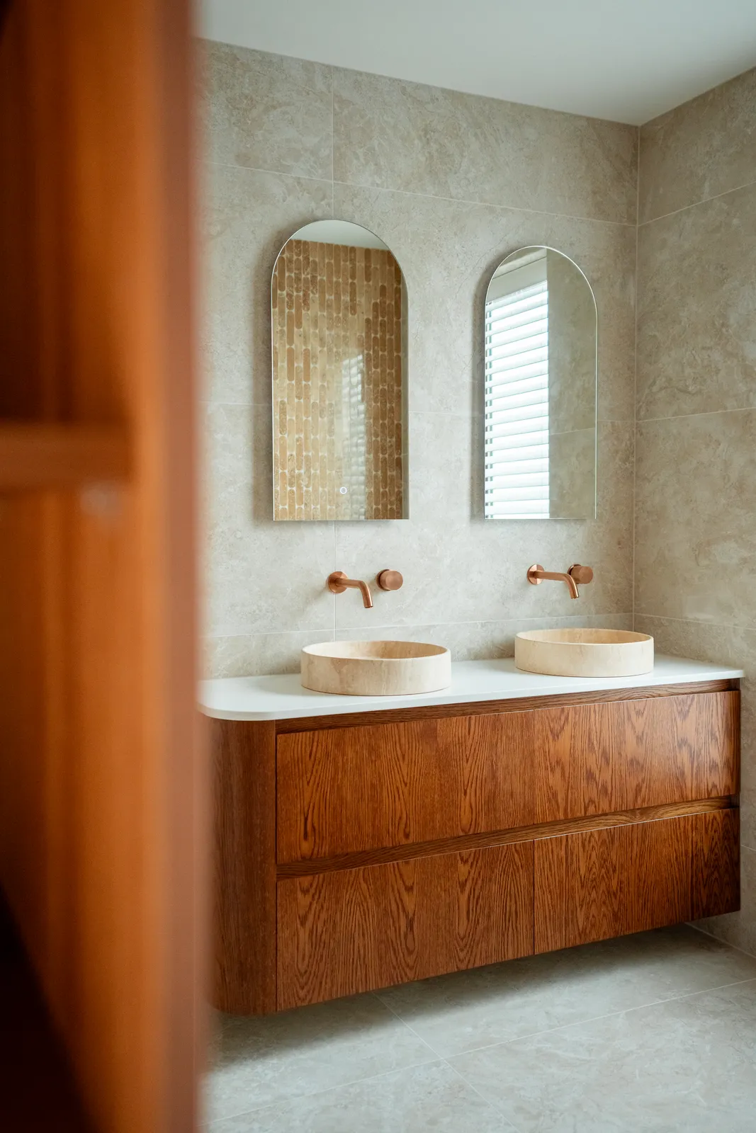Ensuite with twin basins and arched mirrors